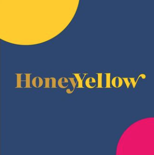 Dark blue background with HoneyYellow in two shades of yellow centered and portions of yellow and pink circles in the top left and right corners respectively.